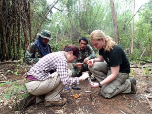 Dr. Kate Jenks collecting a fecal sample for disease testing.