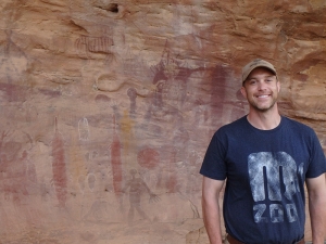 Me at the Split Rock aboriginal cave paintings area, two sawfish painted on the wall to my right.